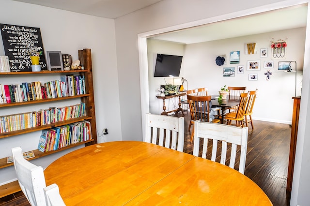 343 N Wood Ln, Fair Grove, MO 65648 - dining area featuring dark wood finished floors and baseboards