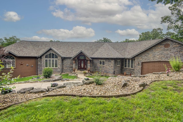 112 Silver Oak Way, Branson West, MO 65737 - view of front of home featuring stone siding, an attached garage, and roof with shingles