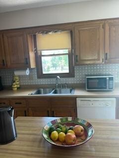 177 Marla Cir, Ozark, MO 65721 - kitchen with stainless steel microwave, dishwasher, and light countertops