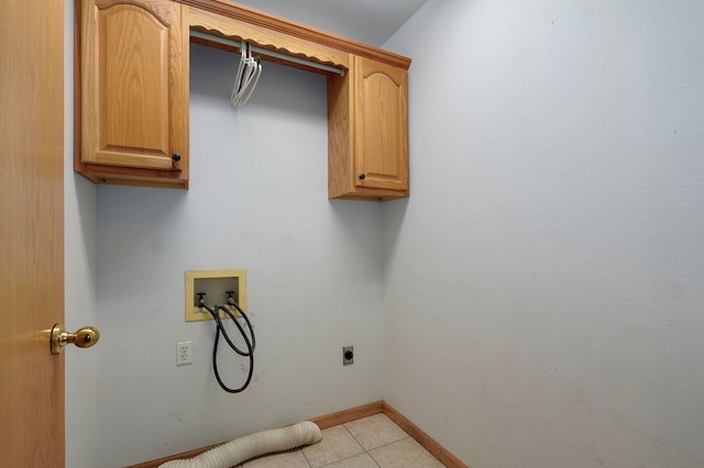 131 Forest Ln, Kimberling City, MO 65686 - laundry area featuring cabinet space, hookup for a washing machine, hookup for an electric dryer, and light tile patterned floors
