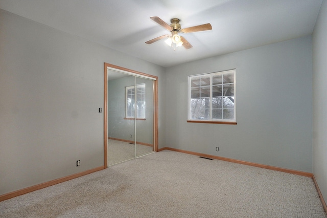 131 Forest Ln, Kimberling City, MO 65686 - unfurnished bedroom with multiple windows, a closet, and carpet