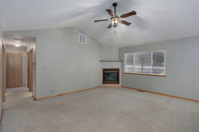 131 Forest Ln, Kimberling City, MO 65686 - unfurnished living room with lofted ceiling, light carpet, ceiling fan, and a glass covered fireplace
