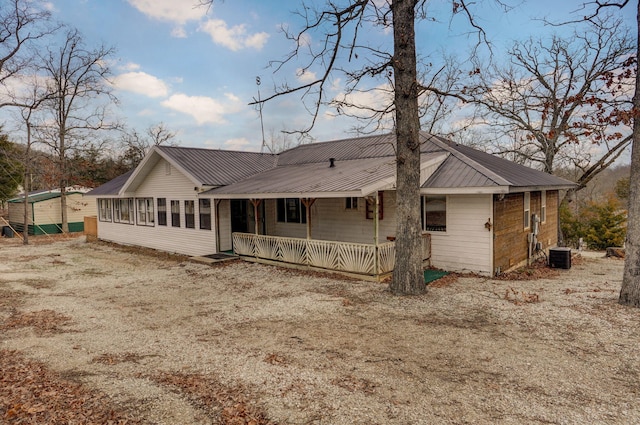 131 Forest Ln, Kimberling City, MO 65686 - back of property featuring covered porch and a metal roof