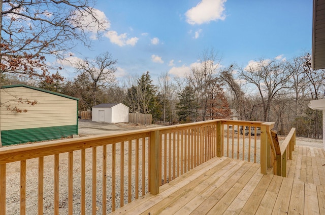 131 Forest Ln, Kimberling City, MO 65686 - wooden terrace featuring a storage unit and view of wooded area