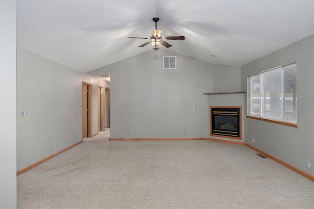 131 Forest Ln, Kimberling City, MO 65686 - unfurnished living room featuring ceiling fan, vaulted ceiling, carpet flooring, and a glass covered fireplace