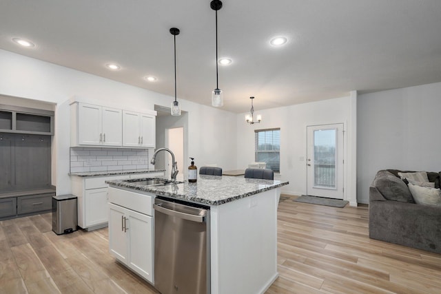 842 E Acacia Ln, Nixa, MO 65714 - kitchen with dishwasher, light stone countertops, light wood-style flooring, white cabinetry, and a chandelier