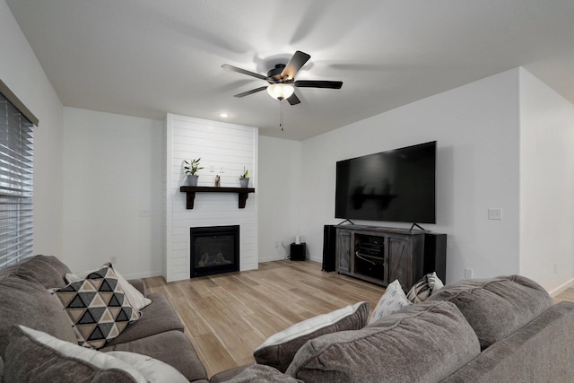 842 E Acacia Ln, Nixa, MO 65714 - living area featuring a fireplace, light wood-style floors, a ceiling fan, and recessed lighting