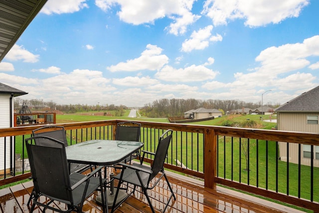 842 E Acacia Ln, Nixa, MO 65714 - wooden deck with outdoor dining space, a lawn, and a residential view