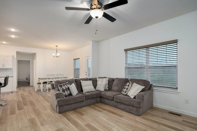 842 E Acacia Ln, Nixa, MO 65714 - living area featuring a chandelier, light wood-style floors, ceiling fan, and recessed lighting