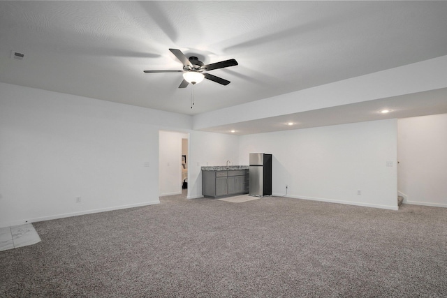 842 E Acacia Ln, Nixa, MO 65714 - unfurnished living room with bar, light carpet, a ceiling fan, and recessed lighting