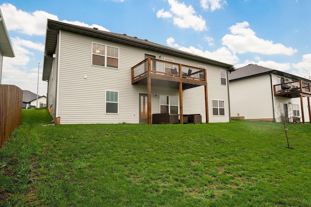 842 E Acacia Ln, Nixa, MO 65714 - rear view of property featuring a lawn and a deck