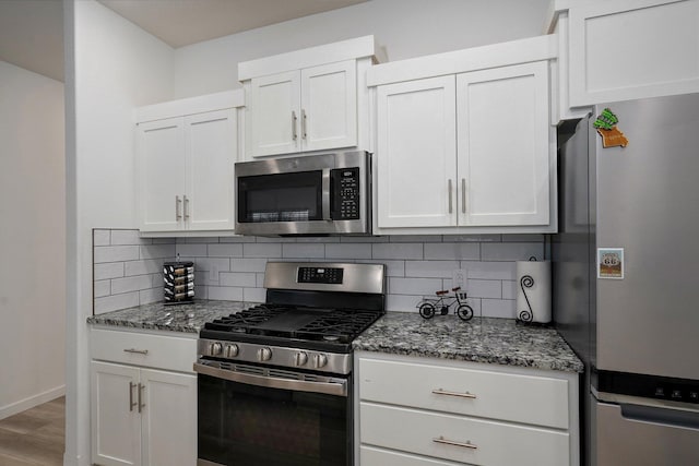 842 E Acacia Ln, Nixa, MO 65714 - kitchen featuring appliances with stainless steel finishes, tasteful backsplash, and stone countertops