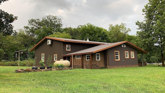 200 NE 90th Ln, Lamar, MO 64759 - view of front of home with a front lawn, a metal roof, and view of scattered trees