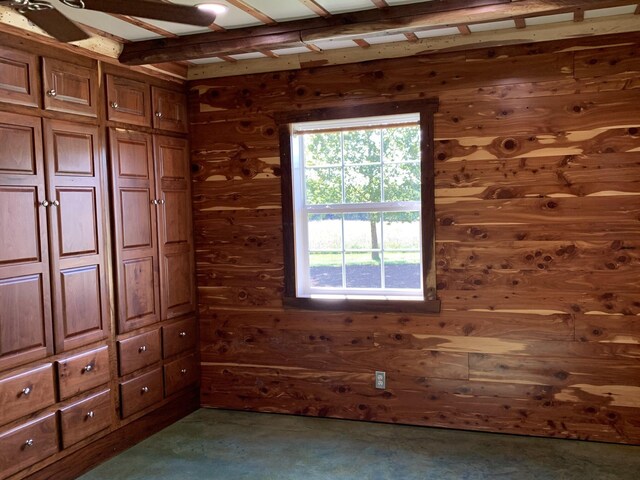 200 NE 90th Ln, Lamar, MO 64759 - unfurnished bedroom featuring wooden walls and dark carpet