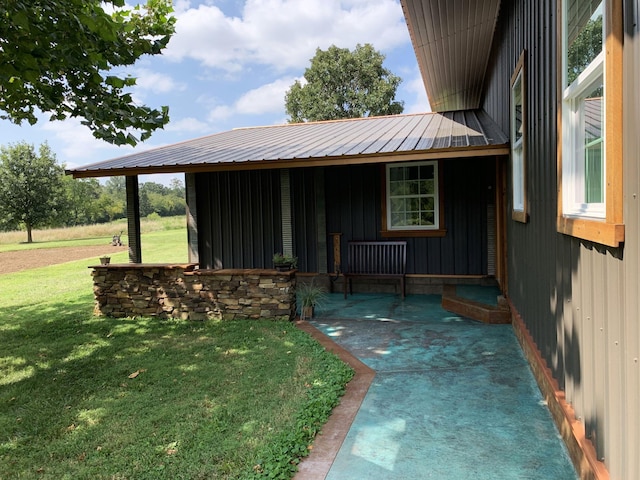 200 NE 90th Ln, Lamar, MO 64759 - doorway to property with a lawn and a metal roof