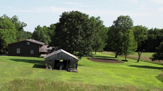 200 NE 90th Ln, Lamar, MO 64759 - view of green lawn with an outbuilding and a pole building