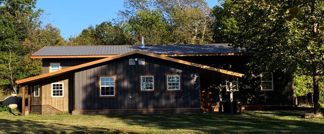 200 NE 90th Ln, Lamar, MO 64759 - view of side of home featuring a yard, a metal roof, and oil tank