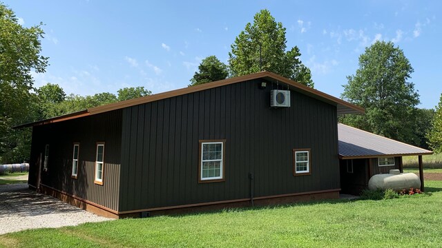 200 NE 90th Ln, Lamar, MO 64759 - view of side of home featuring a lawn