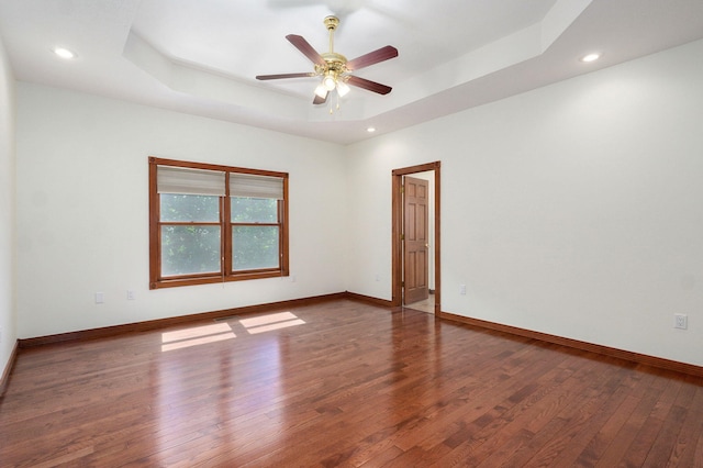 4520 English Ivy Ave, Springfield, MO 65804 - spare room featuring a raised ceiling, wood finished floors, ceiling fan, and recessed lighting