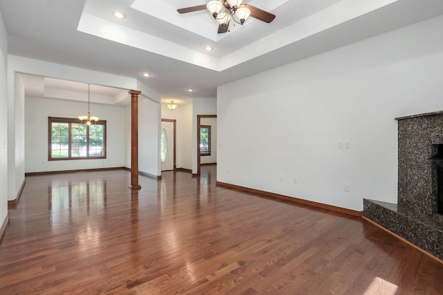 4520 English Ivy Ave, Springfield, MO 65804 - unfurnished living room featuring a raised ceiling, wood finished floors, a ceiling fan, a chandelier, and recessed lighting