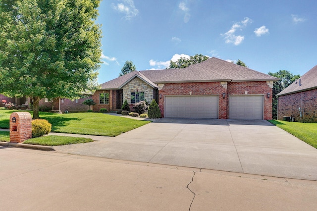 4520 English Ivy Ave, Springfield, MO 65804 - view of front of house featuring a front yard, driveway, a garage, brick siding, and a shingled roof