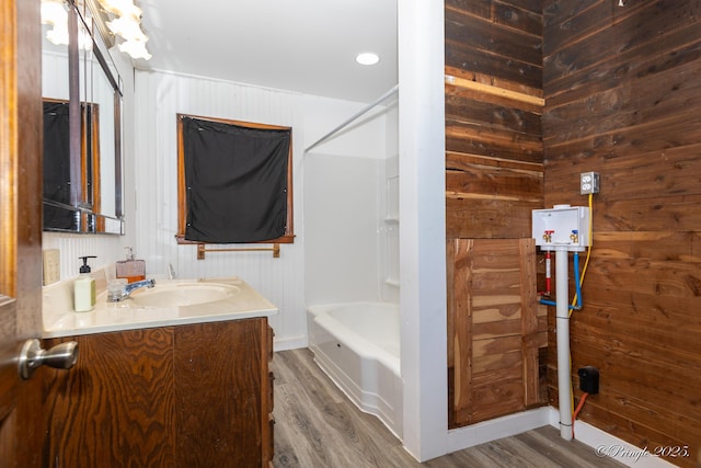 3331 US Highway 160, West Plains, MO 65775 - full bathroom with vanity, wood finished floors, shower / tub combination, and wooden walls