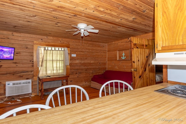 378 63rd Hwy S, Mammoth Spring, AR 72554 - dining space featuring an AC wall unit, a ceiling fan, wooden walls, wooden ceiling, and wood finished floors