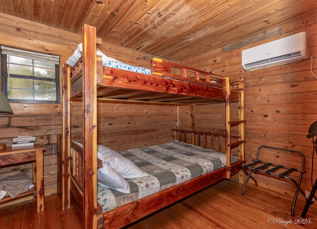 378 63rd Hwy S, Mammoth Spring, AR 72554 - bedroom with an AC wall unit, wood walls, hardwood / wood-style flooring, and wooden ceiling