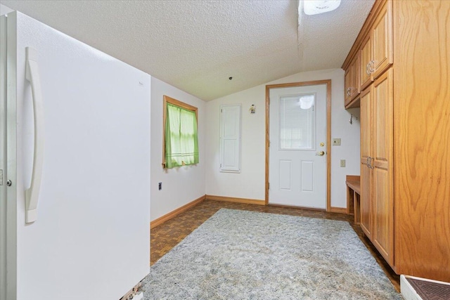 112 Riverview Dr, Anderson, MO 64831 - entrance foyer with vaulted ceiling and a textured ceiling