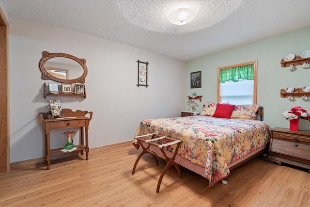 112 Riverview Dr, Anderson, MO 64831 - bedroom featuring wood finished floors and a textured ceiling