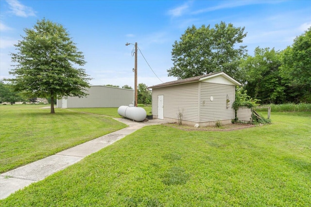 112 Riverview Dr, Anderson, MO 64831 - view of grassy yard featuring an outdoor structure