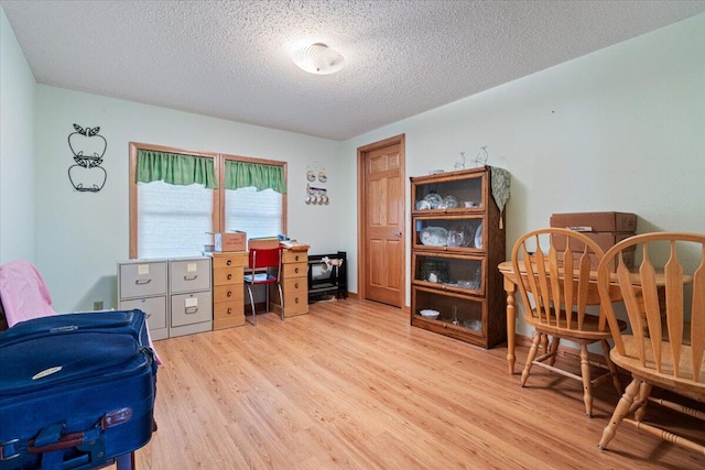 112 Riverview Dr, Anderson, MO 64831 - office area featuring light wood-style flooring and a textured ceiling
