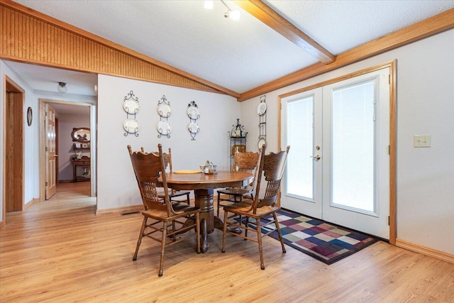 112 Riverview Dr, Anderson, MO 64831 - dining space featuring french doors, light wood-type flooring, and a textured ceiling