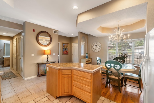 200 Glory Rd Unit 3, Branson, MO 65616 - kitchen with a chandelier, a center island, tile countertops, hanging light fixtures, and recessed lighting