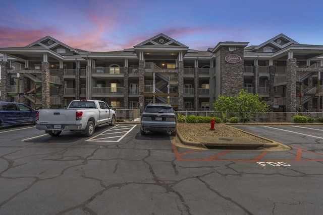 200 Glory Rd Unit 3, Branson, MO 65616 - property at dusk with uncovered parking and a view of apartment building / complex
