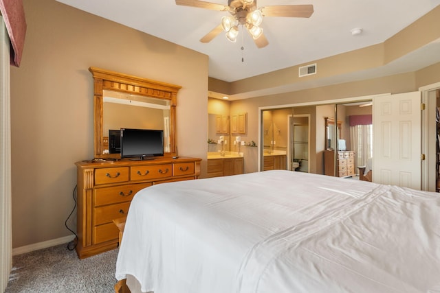 200 Glory Rd Unit 3, Branson, MO 65616 - bedroom with carpet floors, connected bathroom, and a ceiling fan