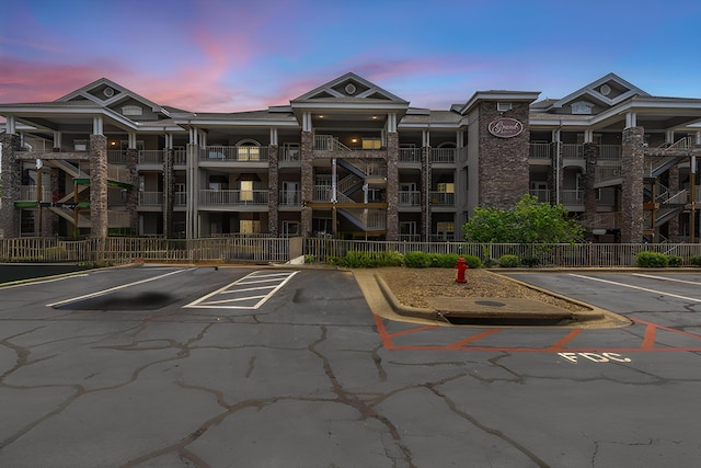200 Glory Rd Unit 3, Branson, MO 65616 - property at dusk with uncovered parking and a view of apartment building / complex