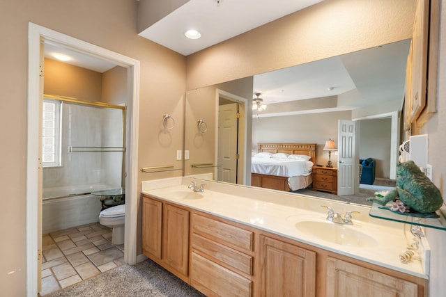 200 Glory Rd Unit 3, Branson, MO 65616 - full bath featuring ensuite bathroom, double vanity, shower / bath combination with glass door, a ceiling fan, and stone finish flooring