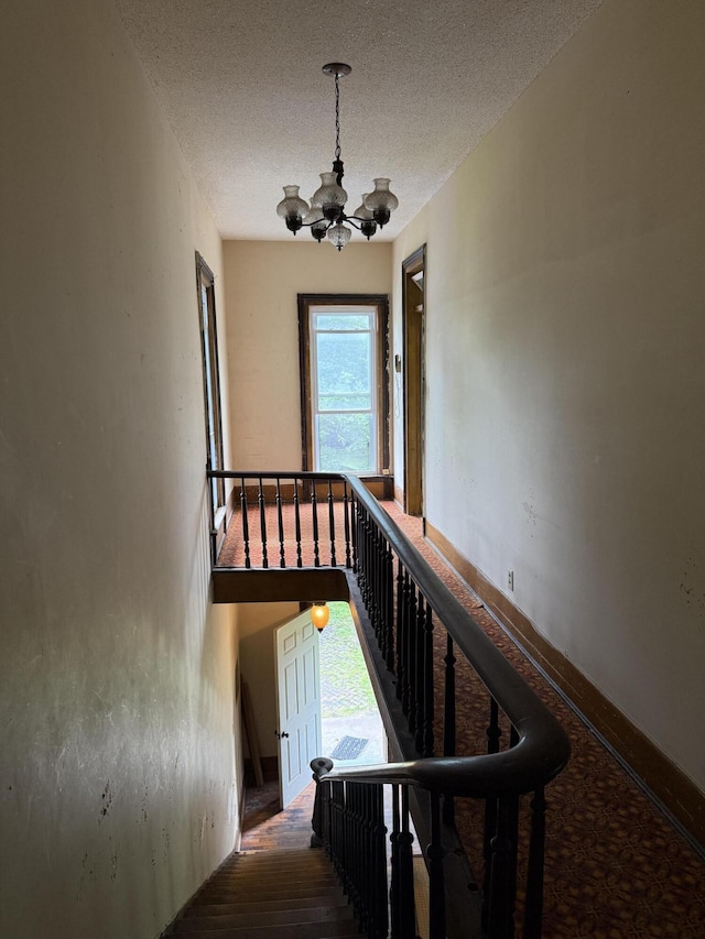 405 N Walnut St, Pierce City, MO 65723 - stairway with a chandelier and a textured ceiling