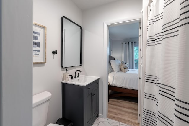 2443 S Kickapoo Ave, Springfield, MO 65804 - full bath with vanity, connected bathroom, and a shower with shower curtain