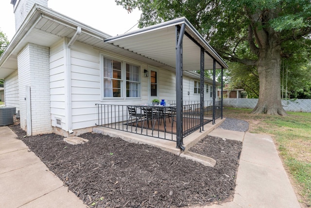 2443 S Kickapoo Ave, Springfield, MO 65804 - view of property exterior with a patio, brick siding, and outdoor dining area