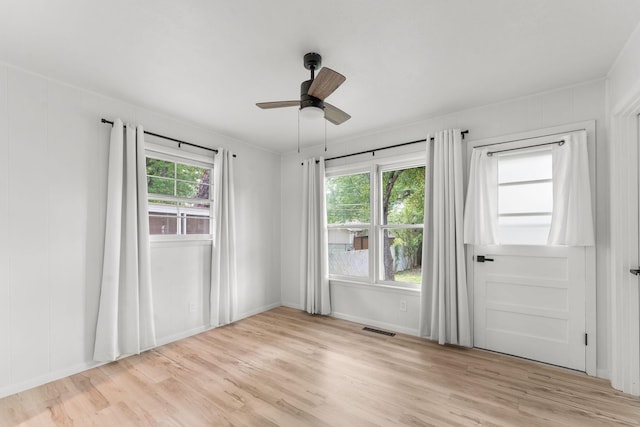 2443 S Kickapoo Ave, Springfield, MO 65804 - unfurnished room with light wood-style floors and a ceiling fan