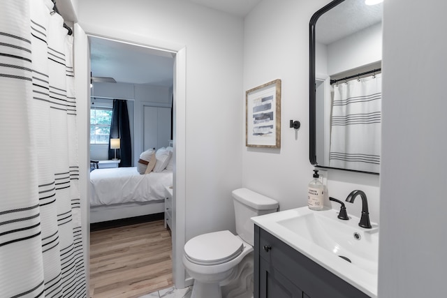 2443 S Kickapoo Ave, Springfield, MO 65804 - ensuite bathroom featuring vanity and curtained shower