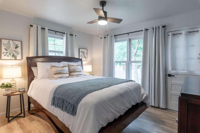 2443 S Kickapoo Ave, Springfield, MO 65804 - bedroom with light wood-style flooring and a ceiling fan