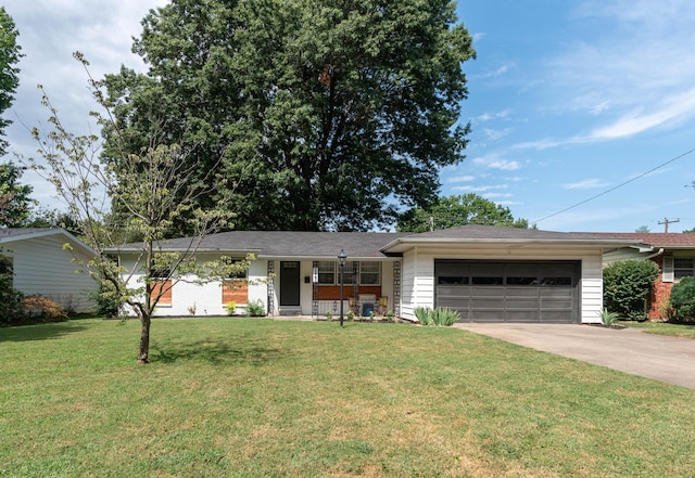 2443 S Kickapoo Ave, Springfield, MO 65804 - ranch-style home featuring a garage, concrete driveway, a front lawn, and a porch