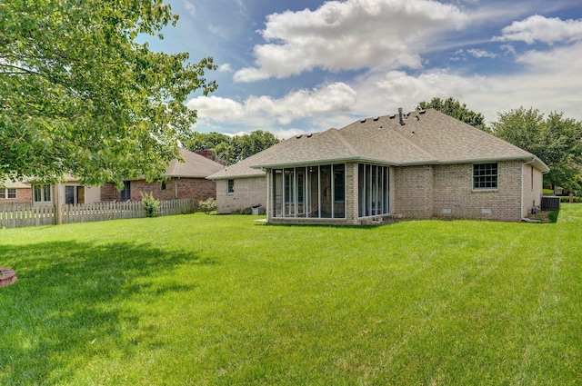 2133 E Cragmont St, Springfield, MO 65804 - rear view of house with brick siding, a sunroom, and roof with shingles