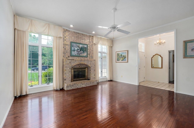 2133 E Cragmont St, Springfield, MO 65804 - unfurnished living room with hardwood / wood-style flooring, ornamental molding, a ceiling fan, a chandelier, and a fireplace