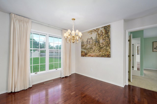 2133 E Cragmont St, Springfield, MO 65804 - spare room with a chandelier and hardwood / wood-style floors