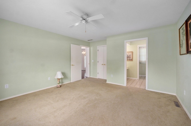 2133 E Cragmont St, Springfield, MO 65804 - unfurnished bedroom with carpet flooring, ensuite bathroom, and a ceiling fan