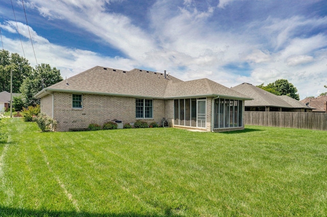 2133 E Cragmont St, Springfield, MO 65804 - back of property with a sunroom, roof with shingles, and brick siding